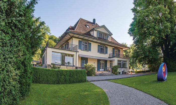 The villa in the park of the campus, with its glazed veranda