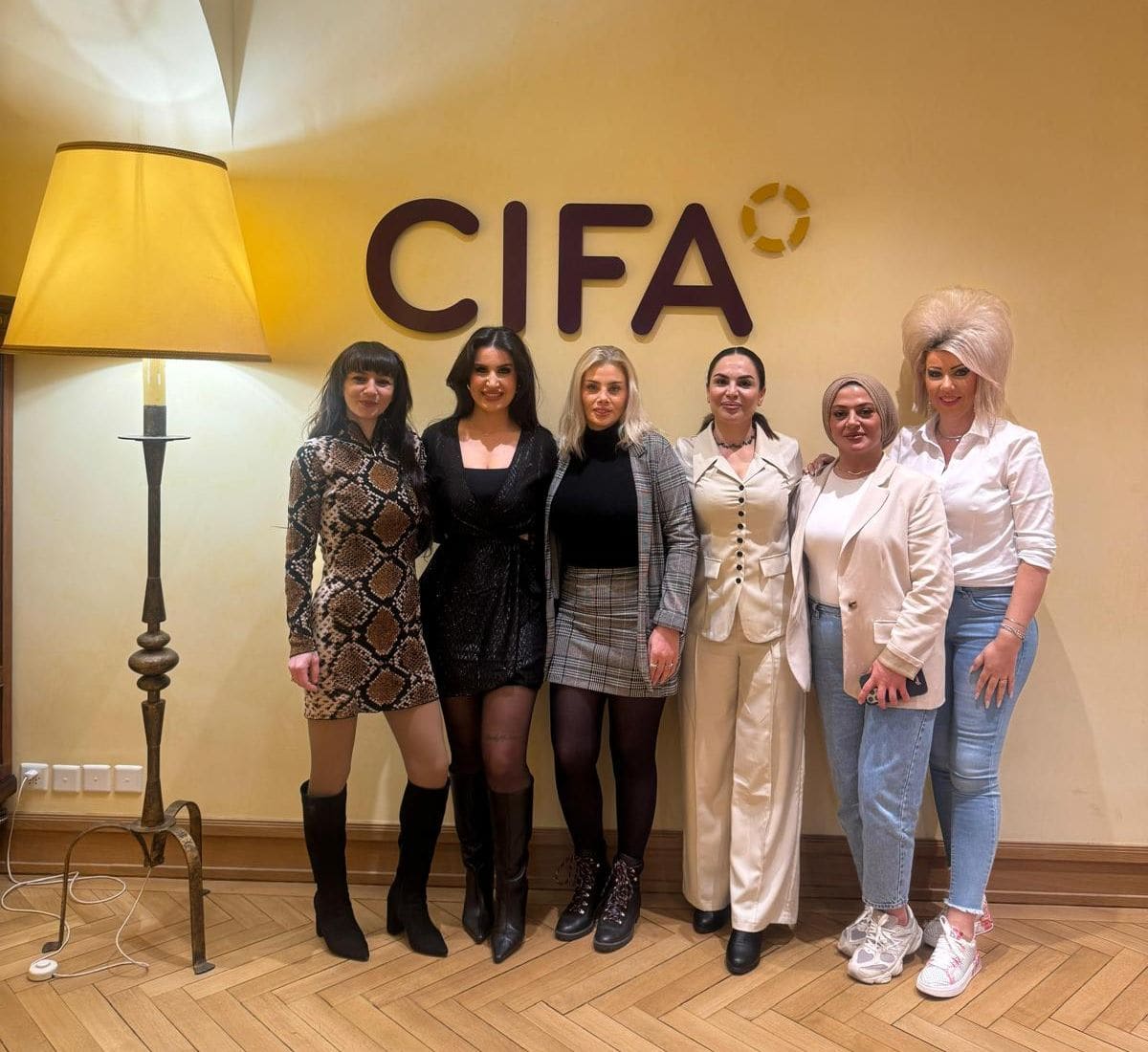 Participants in front of the CIFA lettering at the seat